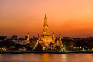 Beautiful view of Wat Arun Temple at sunset in Bangkok, Thailand.