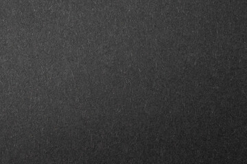 black sheet of paper with a visible texture