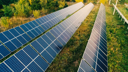 Aerial view of solar panels system on field
