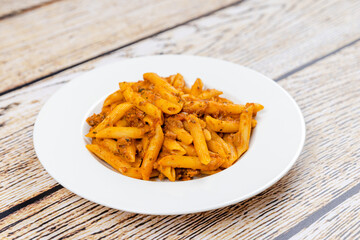 penne pasta with bolognese sauce - 481197079
