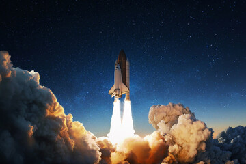 Successful launch of the space shuttle in smoke and blastoff. The rocket flies upward. Startup...