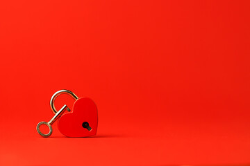 Heart lock with key. Red background. February 14 and Valentine's Day. Love and relationships...