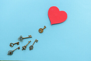 Vintage keys with a red heart . Valentine's Day background. The concept of the key to the heart.