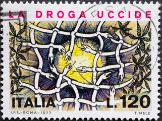 Italy - circa 1977: a postage stamp from Italy showing snakes forming a net. Campaign against Drug...