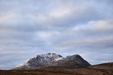 Fototapeta na wymiar Errigal mountain. County Donegal. snowy peak in winter with cloudy sky and beautiful colors