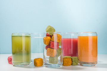 Modern Dissolvable Drinks concept, healthy homemade Dissolvable frozen dried smoothies with vegetables and fruits. Healthy organic snack on white background with frozen dried smoothie cubes 