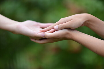 granddaughter and grandmother holding hands