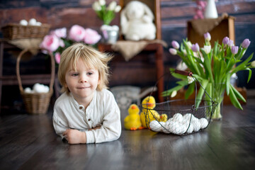 Fototapeta na wymiar Cute toddler blond child, boy with easter decoration