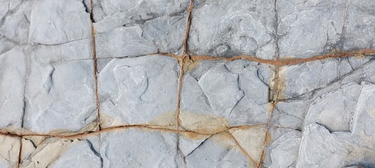 Backgrounds and textures: stone in two different colors with a pattern of squares. Place for text.