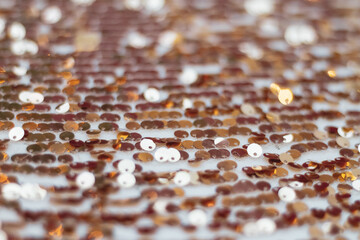 Shiny gold sequins, a background of sequins for a holiday