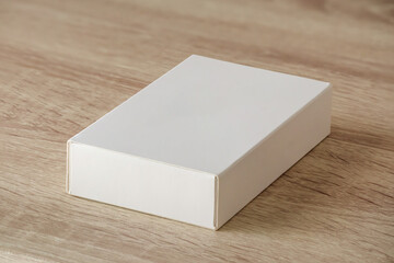 Mockup white box on wood table background