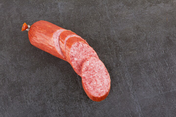 Sausage on a stone background