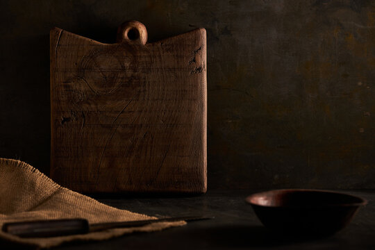 Wooden chopping board on table