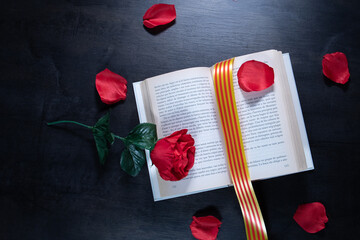 red rose and book with Catalan flag