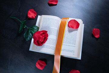 Rose on a book with catalan flag