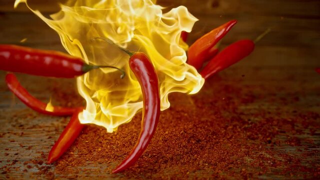 Burning Red Chili Peppers Falling into Chipotle Powder in Slow Motion 1000fps