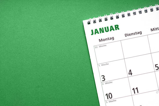 german calendar for the month january on green paper background