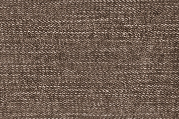 Texture of rough brown fabric close up, flat lay and copy space.