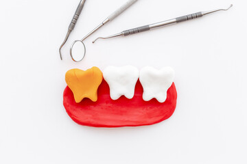 Teeth models with dentist tools. Oral health and care concept