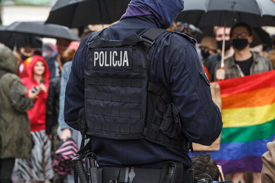 Polish police officer keeping order during Kraków Equality March (Pride parade, LGBTQ) at the Main Market Square in Krakow, Poland.
