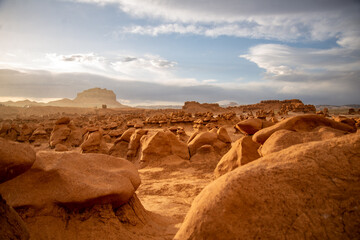Hoodoo formations, created by sandstone erosion, in a desert landscape in Goblin Valley State Park...