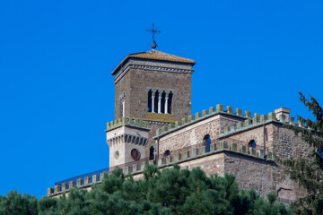 Fototapeta na wymiar Remote view of Bell tower and clock tower of The Santa Maria Assunta Cathedral(Sutri)is one of the few remains of the medieval church in Lazio,Italy.Located in the heart of the ancient city