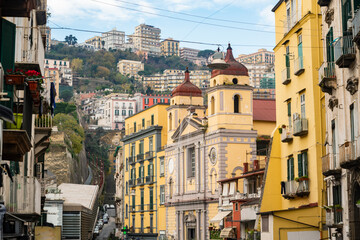 Obraz premium Old overcrowded apartment houses with balconies - dense living in overpopulated Napoli center, Italy