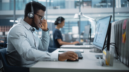 Professional Investment Traders Talking into Headset, Working on Computer with Screen Showing Finance Statistics, Charts Strategy, Stock Market, Telemarketing. Big Office Call Center.