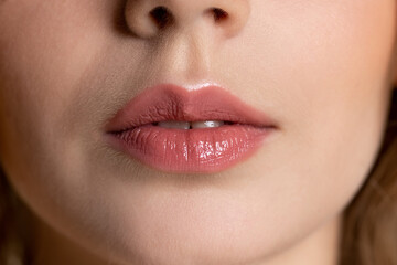 Naklejka premium Beautiful female lips closeup.The beauty and skin care concept at studio