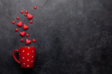 Fototapeta Coffee cup and heart shaped candy obraz