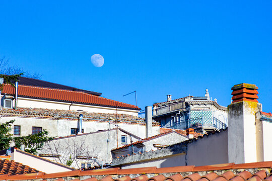Gesualdo, Avellino, Campania, Italy: view of the town roofs with moon in the sky