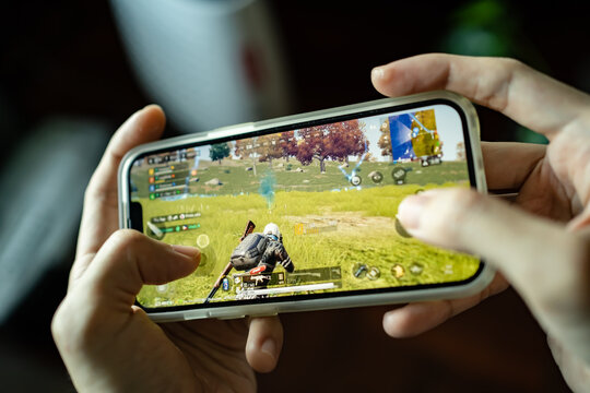 Bangkok, Thailand -January 17, 2022: Gamer playing PUBG: NEW STATE on an iPhone 13.