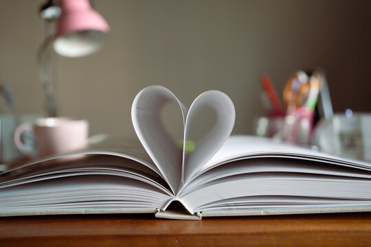 Heart symbol made from a book