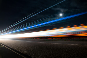 lights of cars with night. long exposure, moon and sky