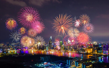 Celebration. Skyline with fireworks light up sky over business district in Ho Chi Minh City ( Saigon ), Vietnam. Beautiful night view cityscape.