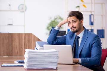 Fototapeta premium Young businessman employee working in the office