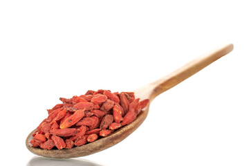Dried sweet goji berries with wooden spoon, close-up, isolated on white.