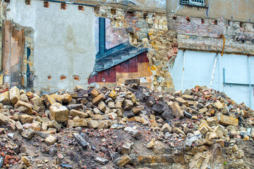 iles of brick rubble, stone and concrete rubble. Remains of the destroyed building.