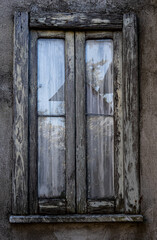 old wooden window with broken glass.