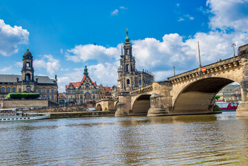 Fototapeta na wymiar DRESDEN, GERMANY - JULY 16, 2016: Dresden city landmarks and Augustus Bridge on a beautiful summer day.