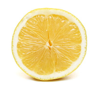 Half yellow ripe lemon isolated on white