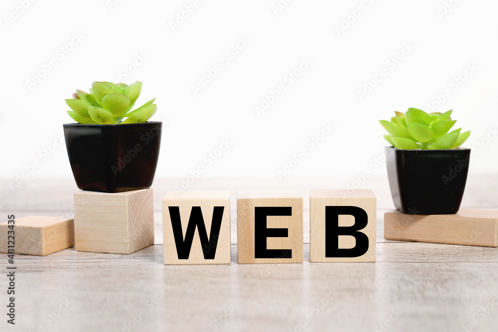 Poster web 3.0 symbol. on a wooden table on three wooden blocks text