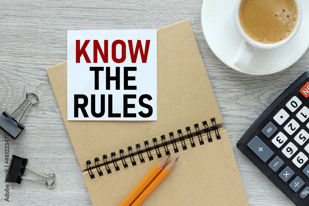 Poster know the rules, white note paper on a notepad on a rustic background. business concept