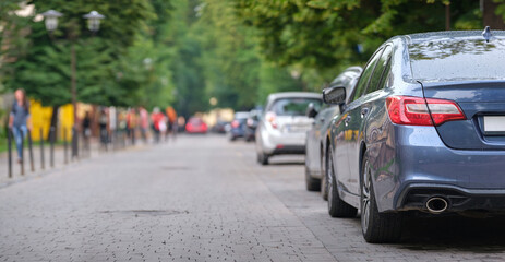 Close up of a car parked illegally against traffic rules on pedestrian city street side