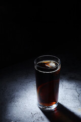 A glass with cola with ice