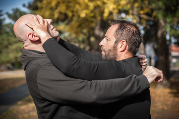 Street fighting self defense technique against holds and grabs