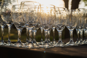 champagne glasses on the table in the sunset