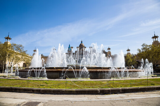 Magic fountain on Montjuic  hill in Barcelona on a sunny summer day. Spain, Catalonia