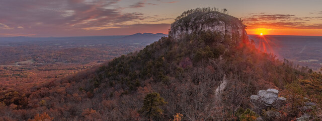 Autumn panorama sunrise view of the knob from Little Pinnacle at Pilot Mountain State Park in...
