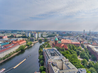 Obraz premium Aerial view of Berlin cityscape from drone in summer season with city landmarks and blue sky, Germany